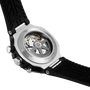 Close-up of a Tissot watch with black strap and visible mechanical components on a white background