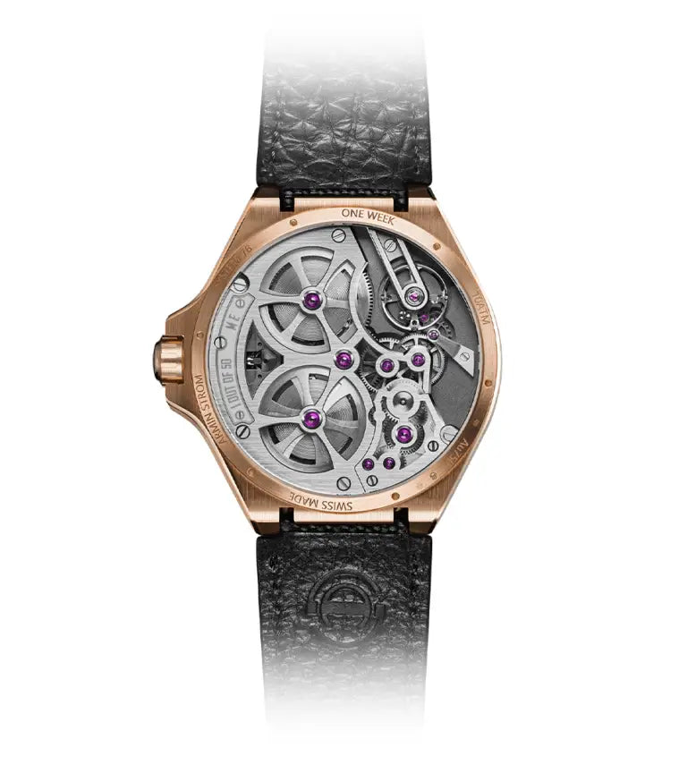 The Armin Strom One Week Skeleton Rose Gold is a luxury watch featuring a black leather strap and a transparent case back that reveals its intricate mechanical movement, all accentuated by elegant rose gold edges.