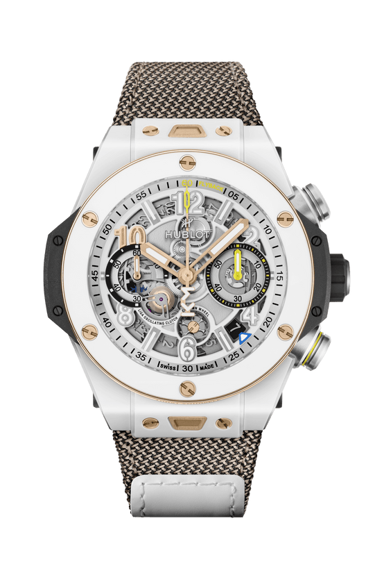 White ceramic chronograph watch with skeletal dial, rose gold accents, and patterned fabric strap.