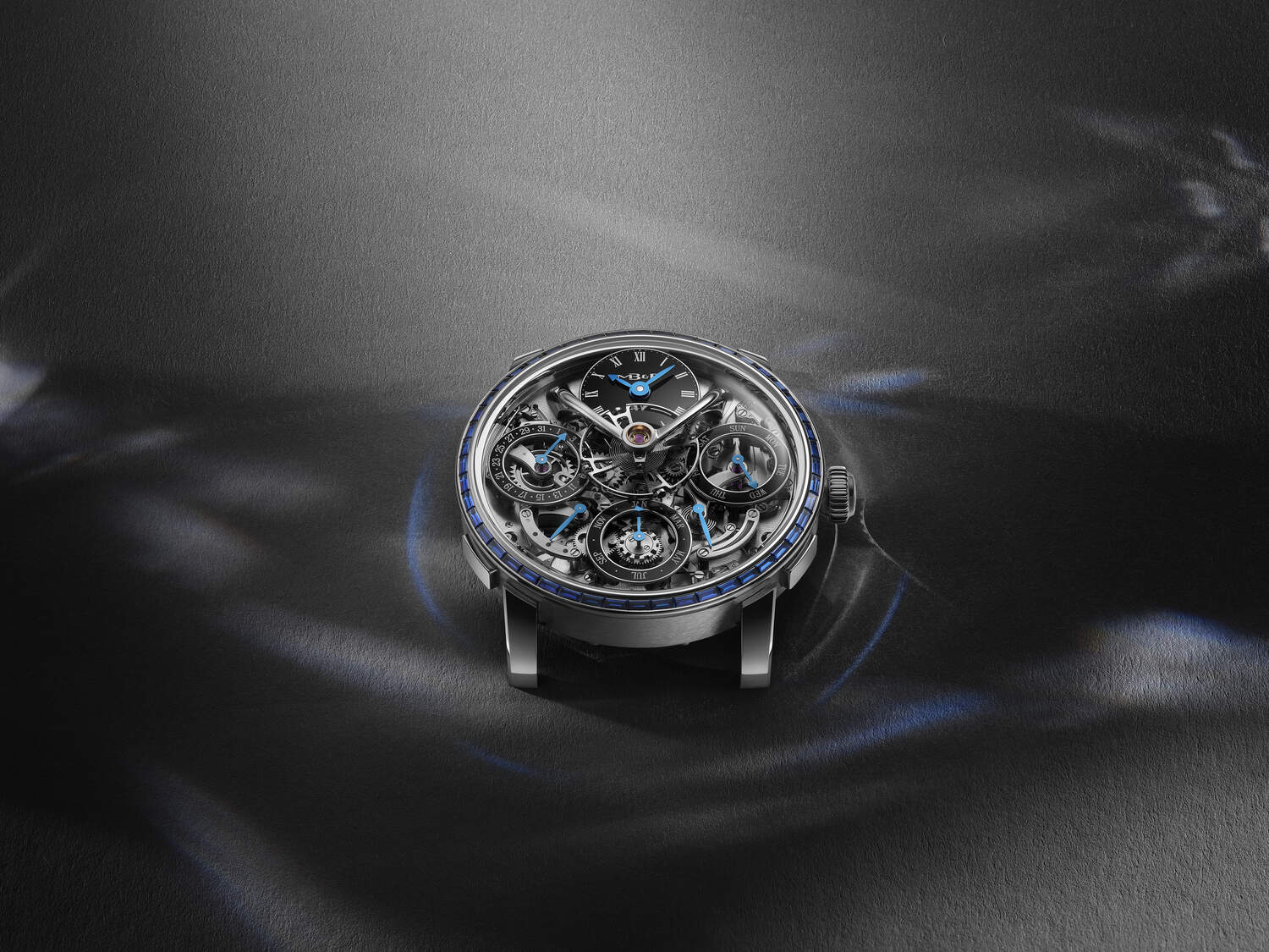 Luxury watch with intricate design on a dark background