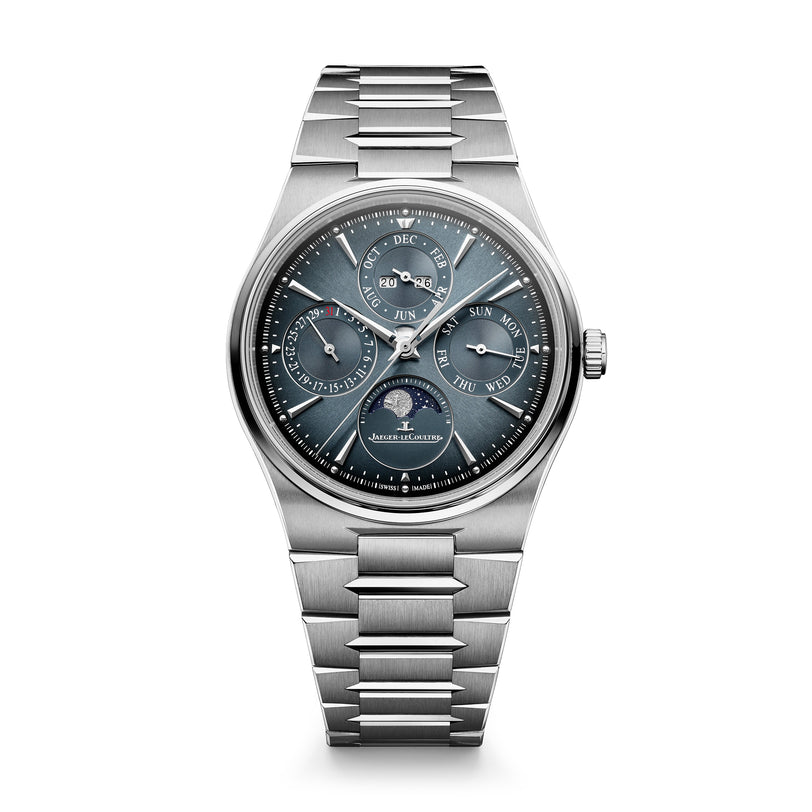 Stainless steel watch with dark blue dial, perpetual calendar subdials, moon phase indicator, and matching metal bracelet.