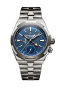 Stainless steel watch with blue dial, dual time zone subdial, orange triangular hand, and brushed metal bracelet.