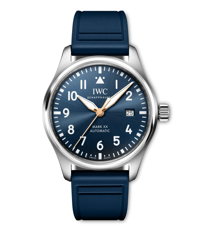 Stainless steel pilot's watch with dark blue dial, Arabic numerals, date window, rose gold hands, and navy rubber strap.
