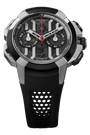Jacq3 & Co stainless steel and black chronograph watch with red accents, black rubber strap, and exposed dial mechanism.