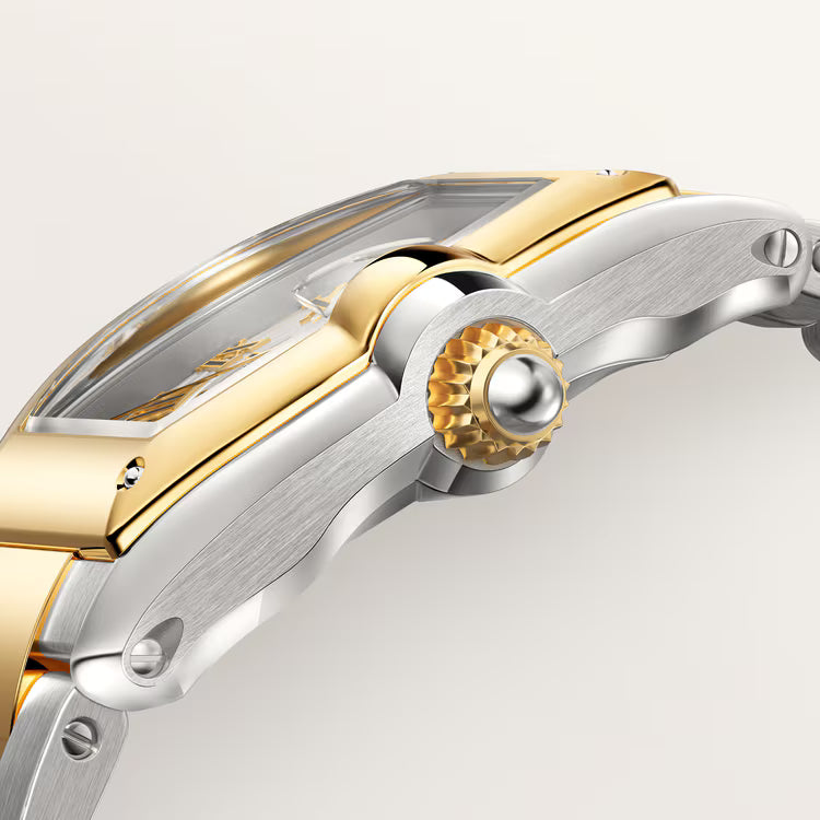 Two-tone Roadster watch with gold and silver case, textured dial, and gold gear-patterned bezel detail.