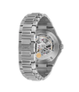 Stainless steel watch with exposed skeleton dial, visible mechanical movement, and linked bracelet displayed at an angle.
