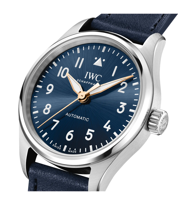 Silver stainless steel watch with dark blue dial, Arabic numerals, golden hands, and dark blue leather strap.