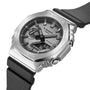 Stainless steel G-Shock watch with black fabric band, analog-digital dial, and square case.