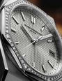 Girard-Perregaux watch with diamond-studded case on a dark background