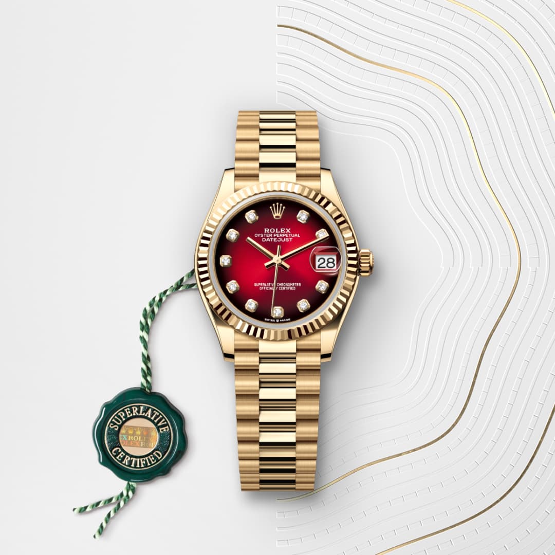Gold Rolex watch with a red dial and diamond markers, displayed on a white patterned background with a green tag.