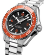A close-up of the OMEGA Seamaster Planet Ocean 600M, a silver dive watch featuring a stainless steel band, black dial, and bold orange bezel with minute markers, displaying the time and its 600m/2000ft depth rating.
