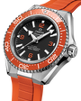Close-up of the OMEGA Seamaster Planet Ocean 600M with a black dial, white markers, orange accents, and bezel. This Co-Axial Master Chronometer has a matching orange rubber strap and is water-resistant to 600m/2000ft.