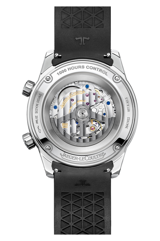 A close-up of the Jaeger-LeCoultre Polaris Date watch back reveals the intricate Calibre 899 movement through a transparent case, fine engravings, and a black textured rubber strap.