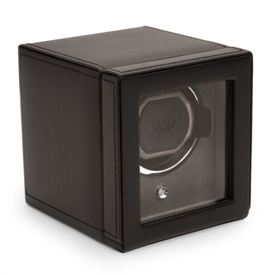 Black leather watch winder with single circular watch holder, transparent front window, and solid top cover.