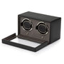 Black leather watch winder with two rotating watch cups, open drawer base, and removable top cover.