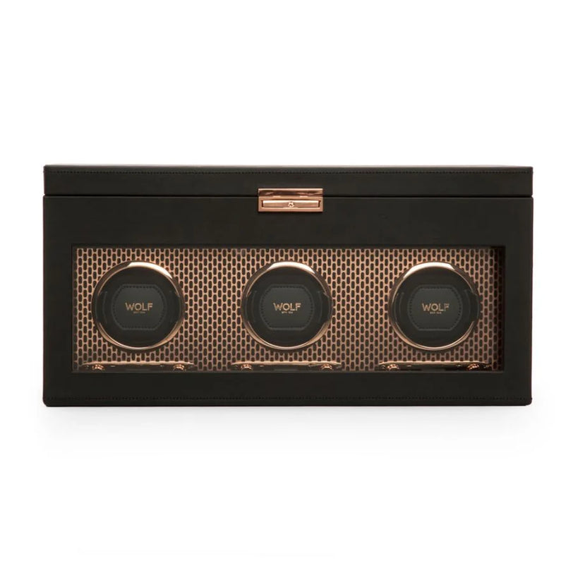 Black watch winder box with three rotating watch holders and rose gold accents.