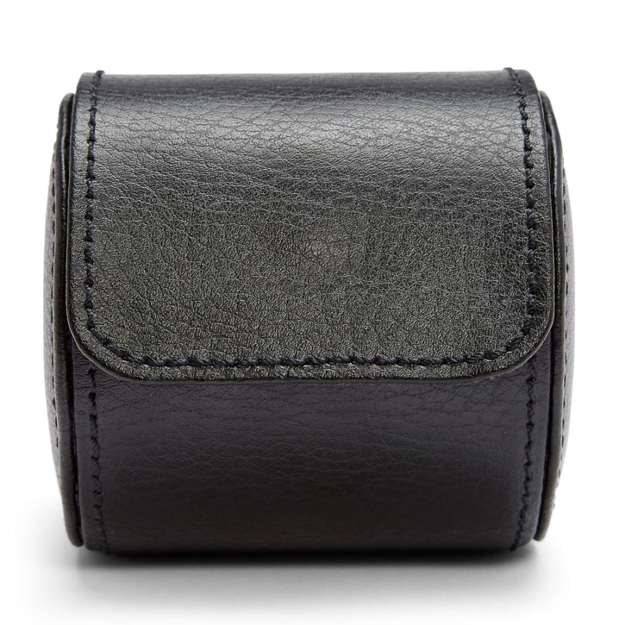 Black leather cylindrical watch roll with flap closure and visible stitching details.