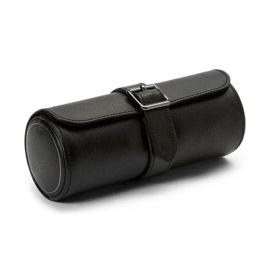 Black leather cylindrical watch roll with three compartments, metal buckle closure, and stitched seams.