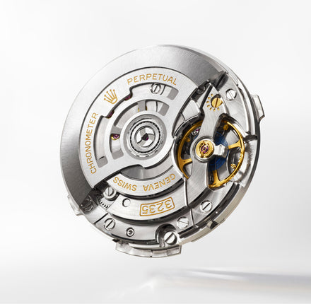 Watch mechanism with 'Rolex' branding on a white background