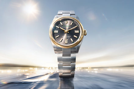 Luxury watch with silver and gold case on a blurred background