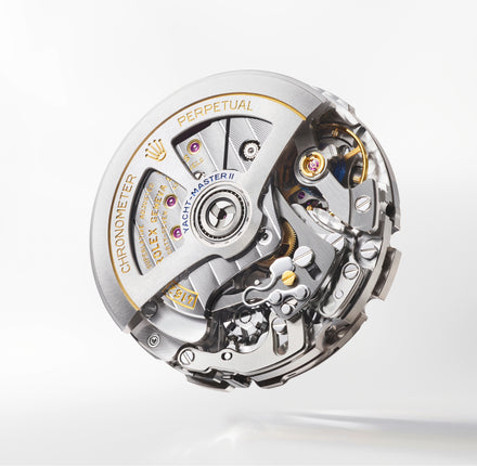 Close-up of a Rolex watch mechanism on a white background