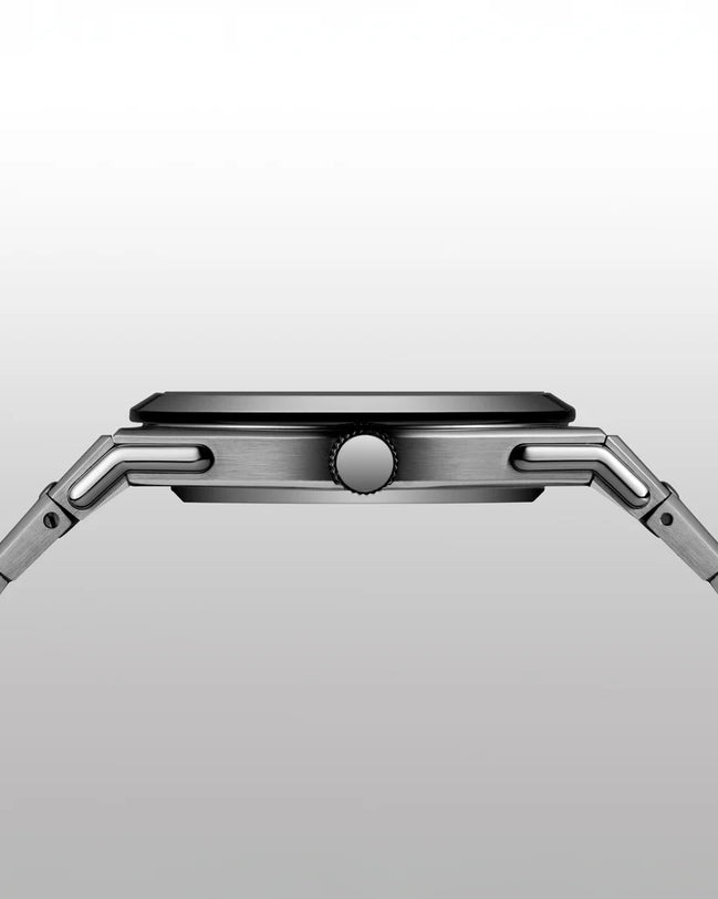 Close-up of a silver smartwatch on a light gray background