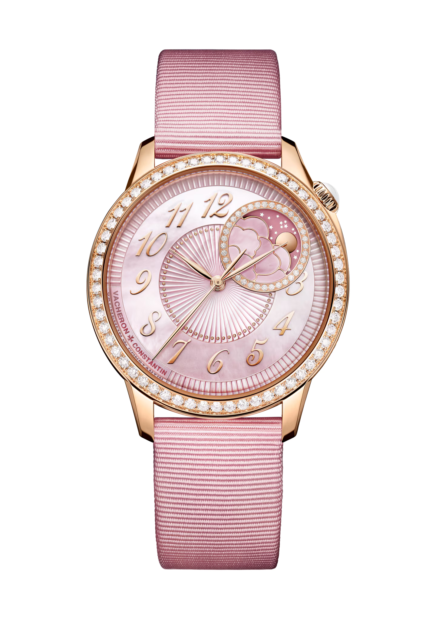 Rose gold watch with pink dial, diamond bezel, moon phase complication, and pink textile strap.
