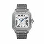 The Cartier Santos De Cartier Large Model features a silver square face, Roman numeral markers, blue hands, automatic movement, a 6 o’clock date window, and a metal bracelet with visible screw details.